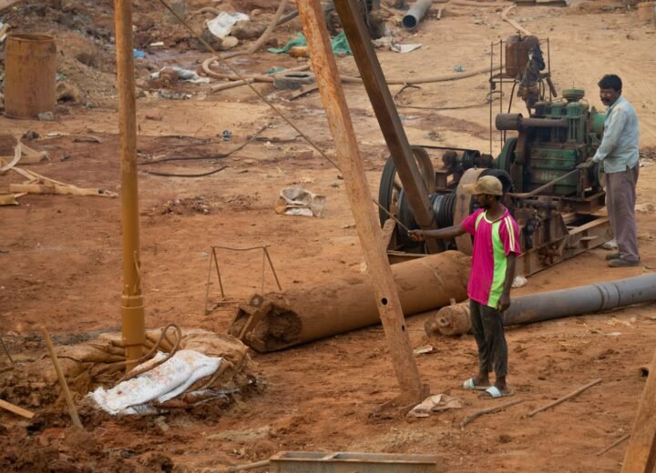 A group of people standing around a construction site